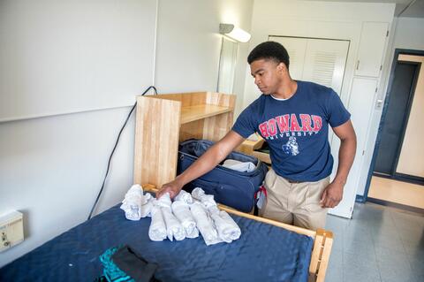 A Howard student moving into a dorm.
