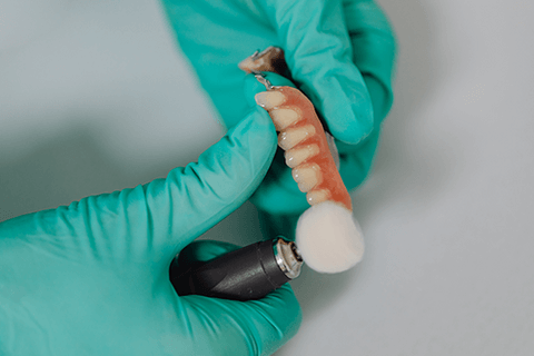Dentist cleaning teeth