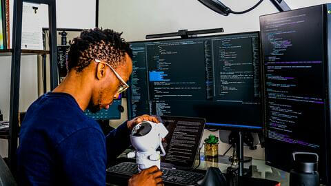 Man at table coding