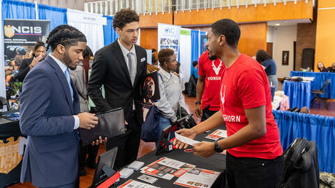 Howard students discussing careers at a networking event