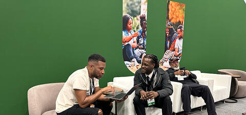 Afro Tech conference participants seated and talking together